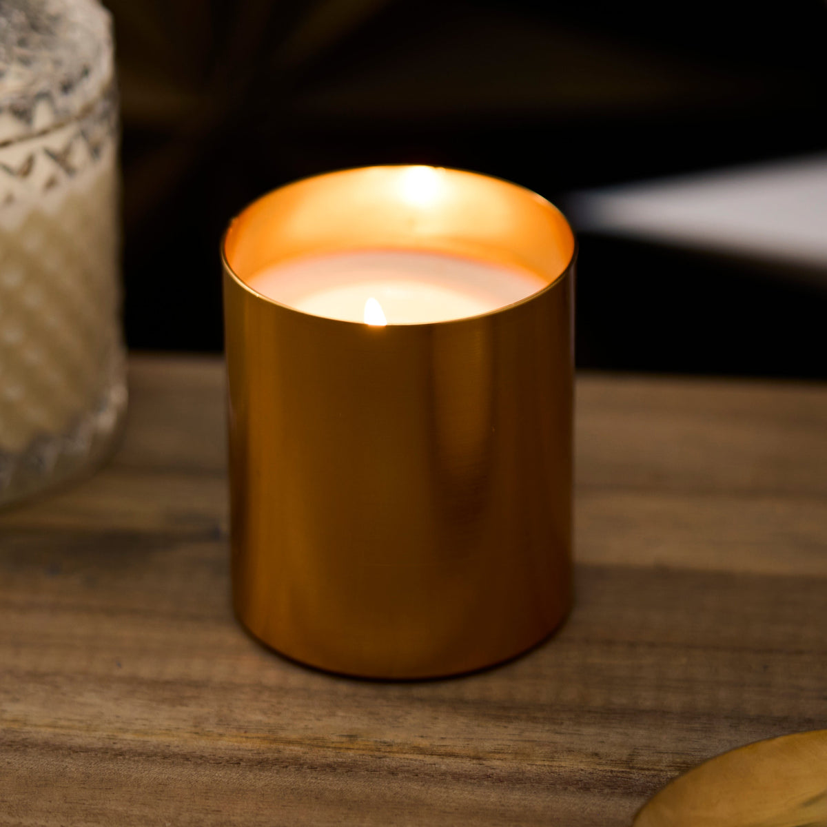 candle in gold jar
