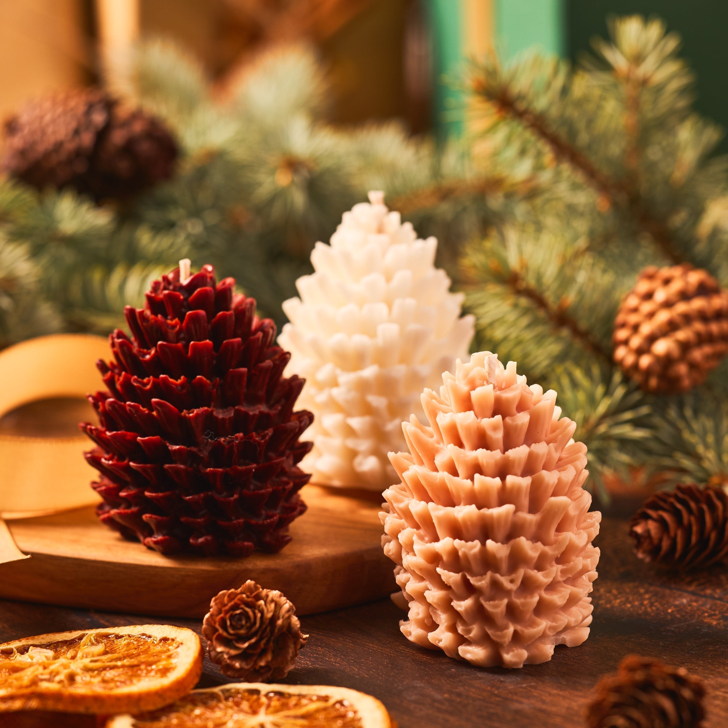 pinecone candles in front of a tree